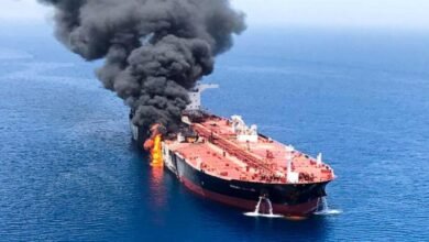 A large crude oil tanker sails through the Strait of Hormuz.