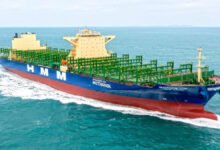 HMM's first methanol-powered containership, a large vessel, sailing on open water.