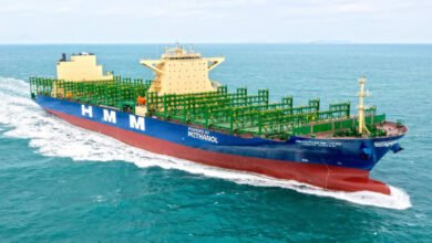 HMM's first methanol-powered containership, a large vessel, sailing on open water.