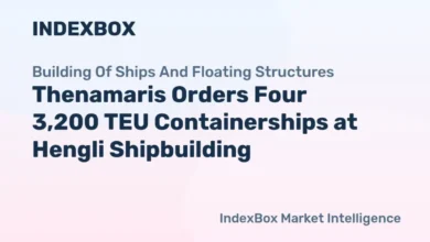 A large containership sails, representing Thenamaris's expanded boxship fleet.