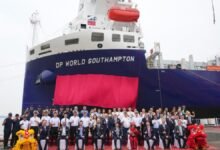 The new DP World London methanol dual-fuel feeder ship docked at a port.