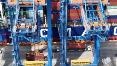 Large container ship sailing on the ocean, central to green shipping corridor initiatives.