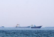 A large oil tanker transits the busy waters of the Strait of Hormuz.