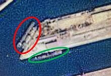A large Russian military cargo ship sails on the open sea.