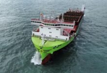 An X-Press Feeders container ship navigates a waterway.