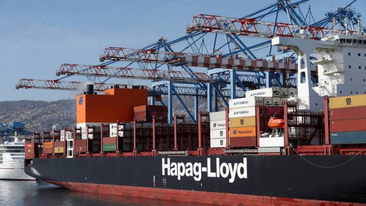 Hapag-Lloyd container ship docked at a DP World terminal with cranes loading cargo.