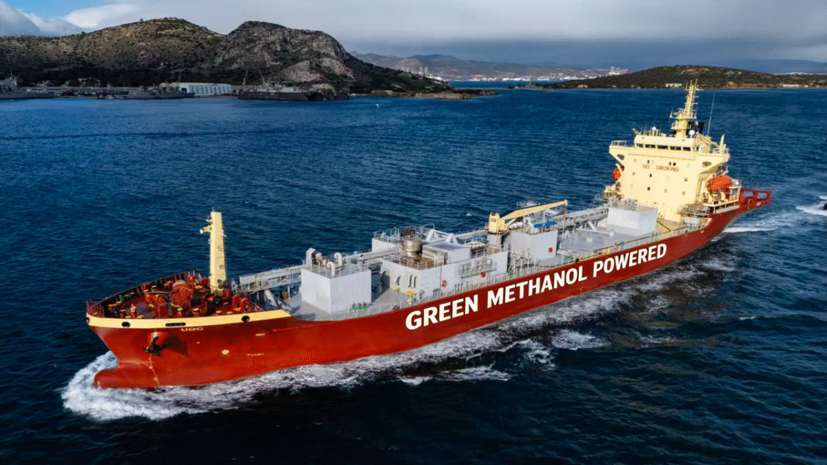 A large methanol-powered cement carrier ship sails on the water.