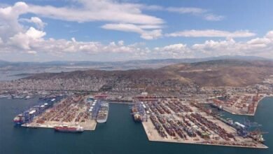 Container ships and cranes at COSCO-managed Piraeus Port container terminal.