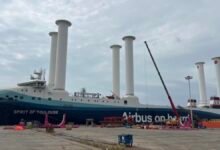 The Spirit of Toulouse RoRo vessel with six white Norsepower rotor sails at sea.