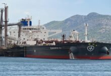 A large Norwegian oil tanker sails on the open sea.