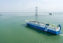 China's largest solar and LNG dual-fuel vessel, YUAN HAI KOU, sails on calm waters.