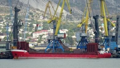 An aging cargo freighter sailing at sea, representing the vessel banned by the Paris MoU.