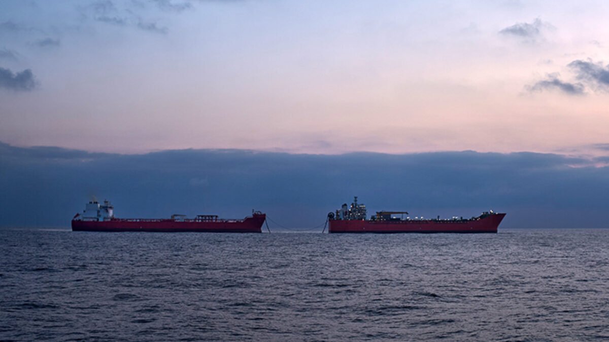 Two supertankers are engaged in a ship-to-ship transfer of crude oil at sea.