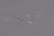A large oil tanker sails through the strategic Strait of Hormuz.