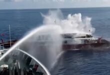 Taiwan Coast Guard vessel fires a water cannon at a Chinese fishing boat.