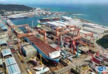 A large container ship, symbolizing the new 13,000-TEU vessels HMM ordered.