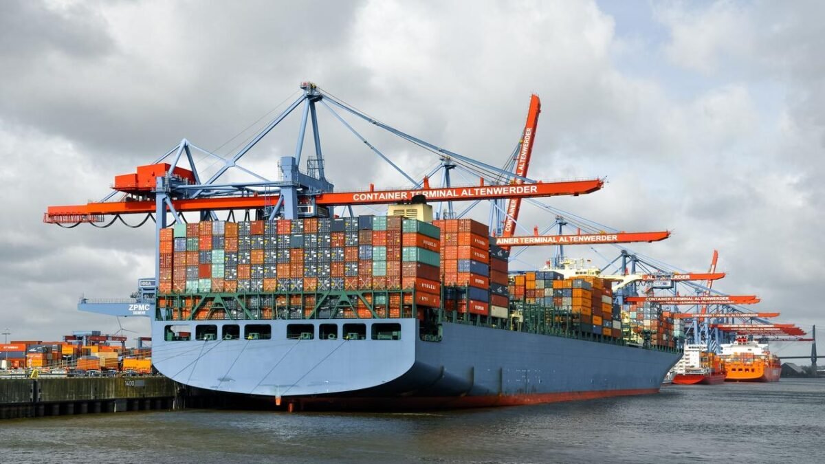 Container ships and cranes at a busy port, reflecting freight volume and capacity.
