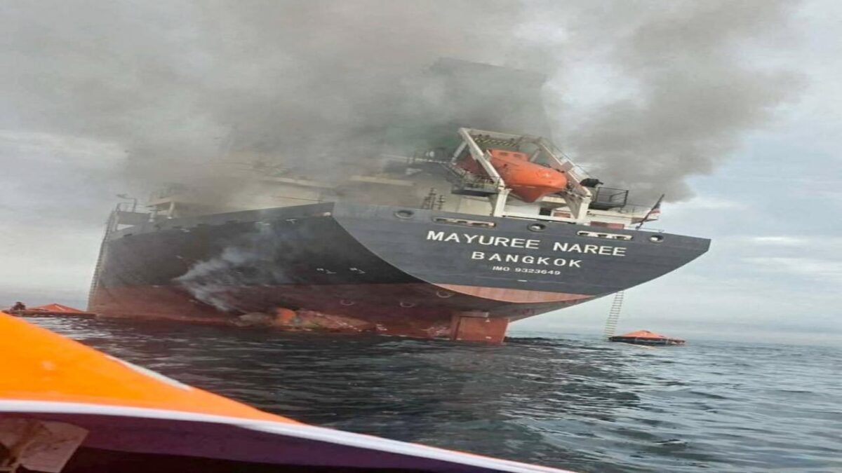An oil tanker sails through the Strait of Hormuz, a critical maritime shipping route.