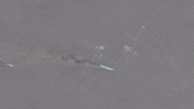 A large oil tanker sails through the strategic Strait of Hormuz.
