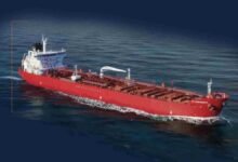 A large modern oil tanker ship, like Scorpio Tankers' new VLCCs, sailing on the open sea.