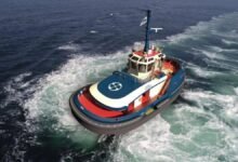 An electric tug showcasing AYK Energy's marine battery technology.