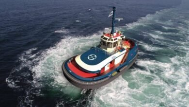 An electric tug showcasing AYK Energy's marine battery technology.