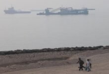 An oil tanker sails on the sea, representing vessels at risk in the Strait of Hormuz.