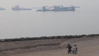 An oil tanker sails on the sea, representing vessels at risk in the Strait of Hormuz.