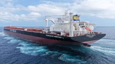 CMB.TECH's 'Mineral Europa,' a large grey dry bulk carrier, sails on the ocean.