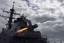 The USS Arleigh Burke destroyer undergoes maintenance in a dry dock.