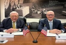 ABS and U.S. Department of Energy leaders shake hands after signing a maritime nuclear technology agreement.