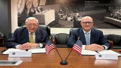 ABS and U.S. Department of Energy leaders shake hands after signing a maritime nuclear technology agreement.